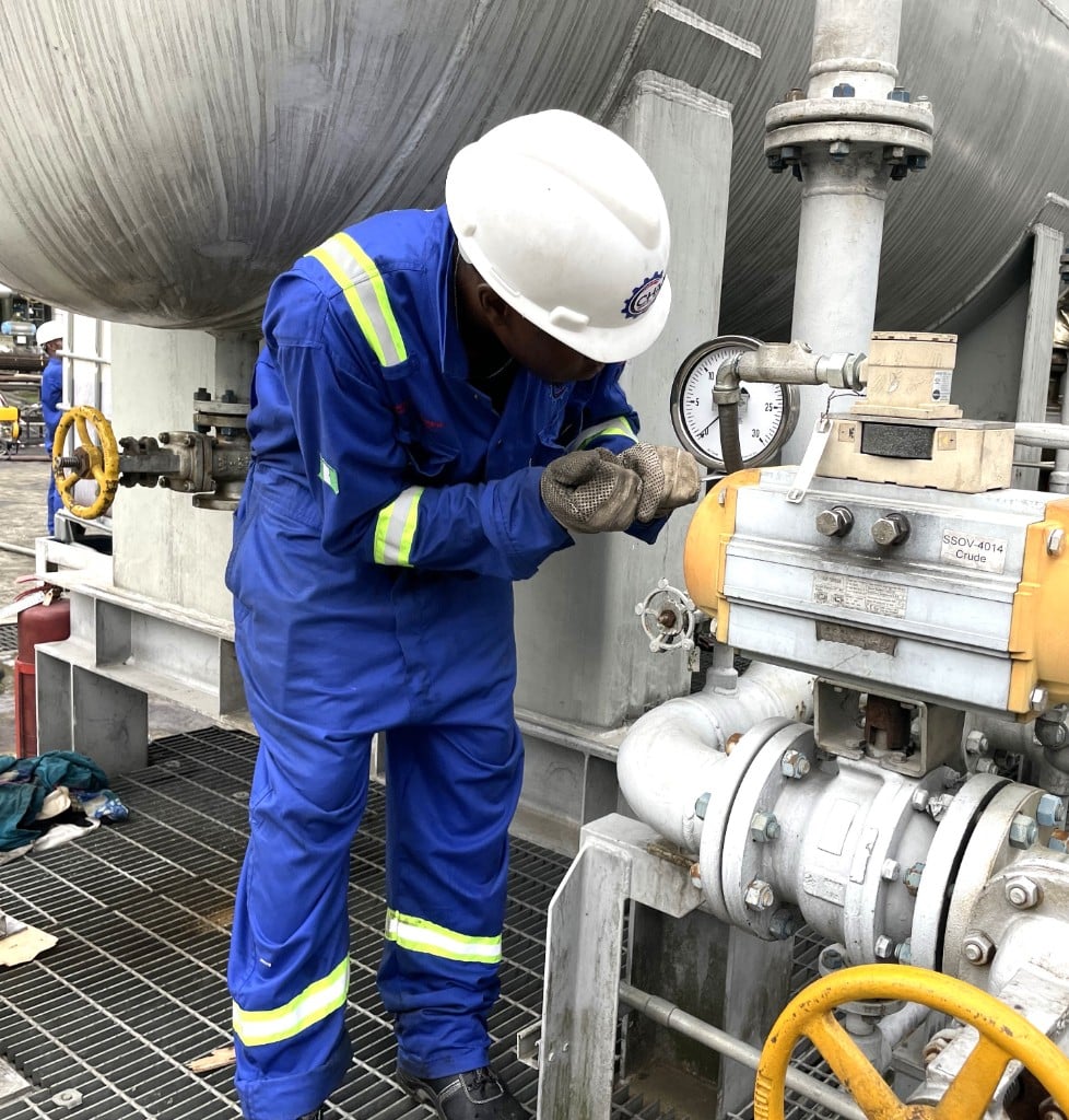 CHAAD engineer inspecting industrial valves and pressure gauges on site