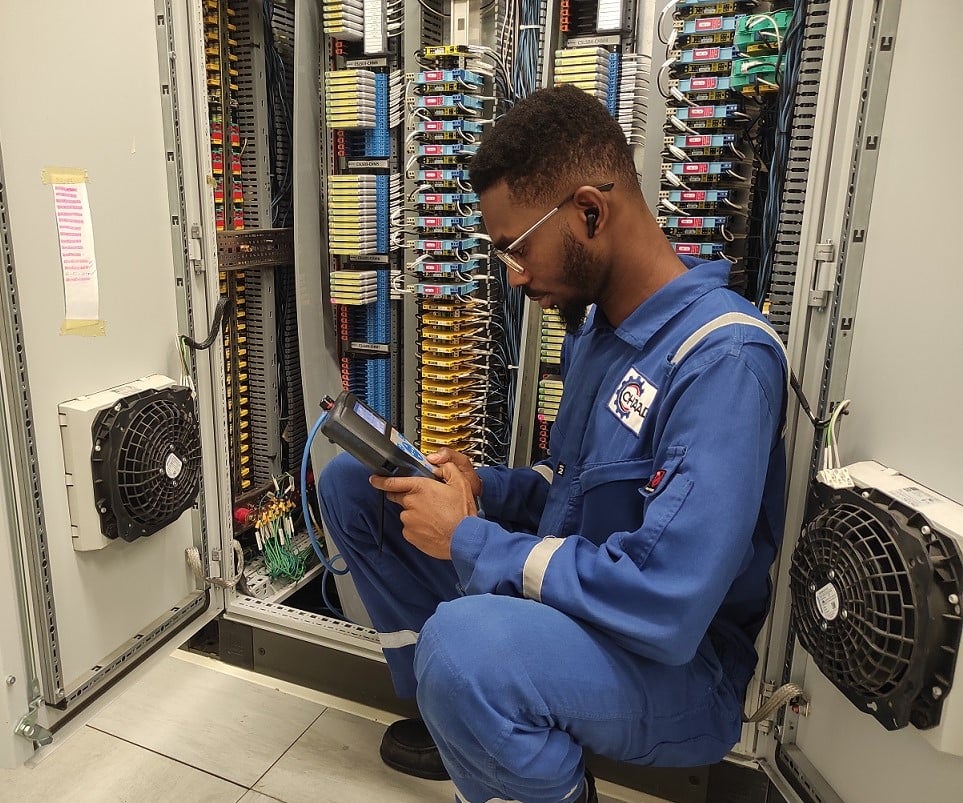 CHAAD engineer testing industrial electrical control panel